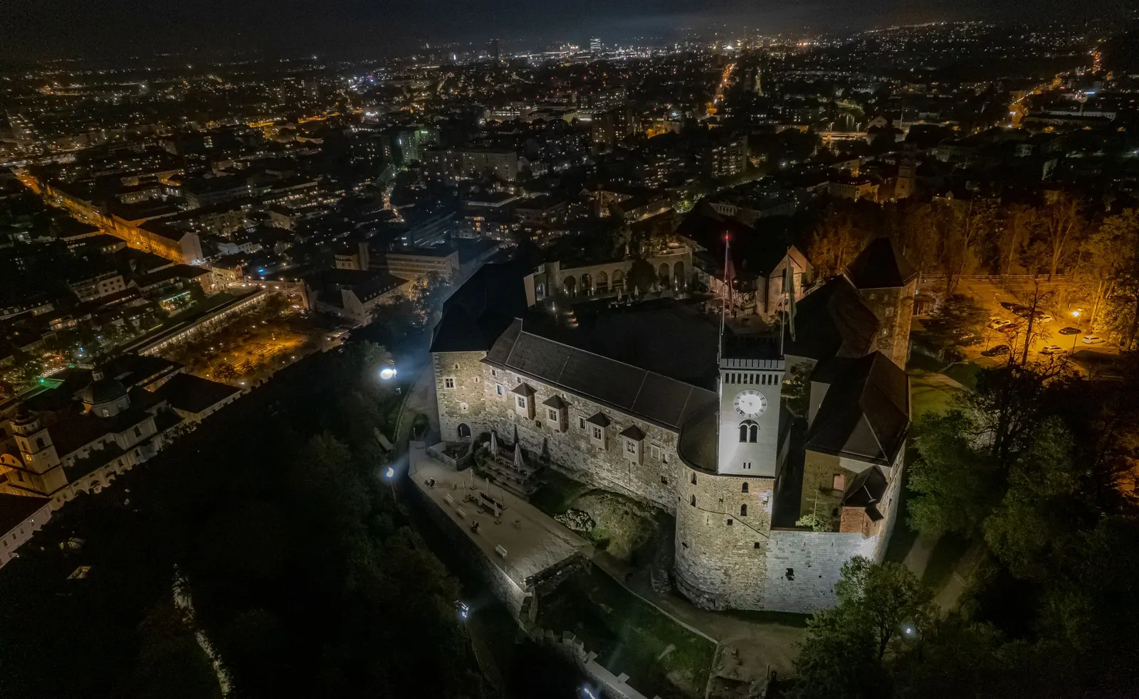 Ljubljana Castle at night, above the lights of the city